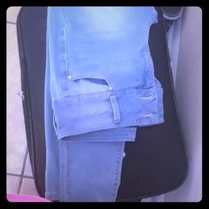 A pair light blue jeans